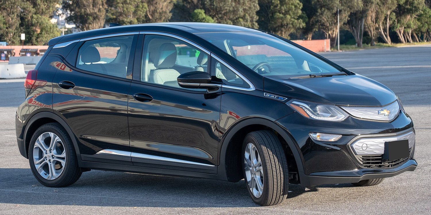 A black Chevrolet Bolt EV, a battery electric hatchback, parked in a lot