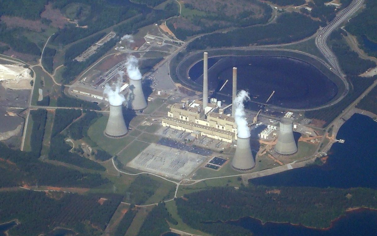 Aerial view of Plant Scherer, a coal-fired power plant in Georgia, with steam rising from its cooling towers