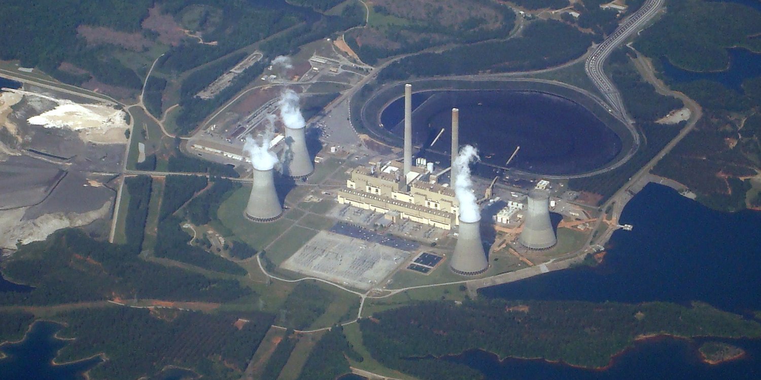 Aerial view of Plant Scherer, a coal-fired power plant in Georgia, with steam rising from its cooling towers